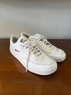 Nike Men’s White Leather Sneakers with Orange Swoosh